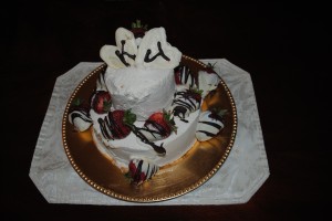 Wedding cake with chocolate covered strawberries